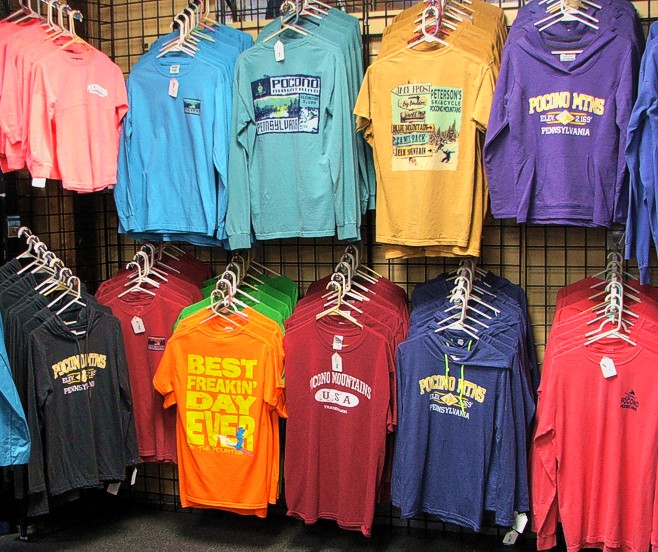 Pocono Souvenir Tee Shirts on Wall